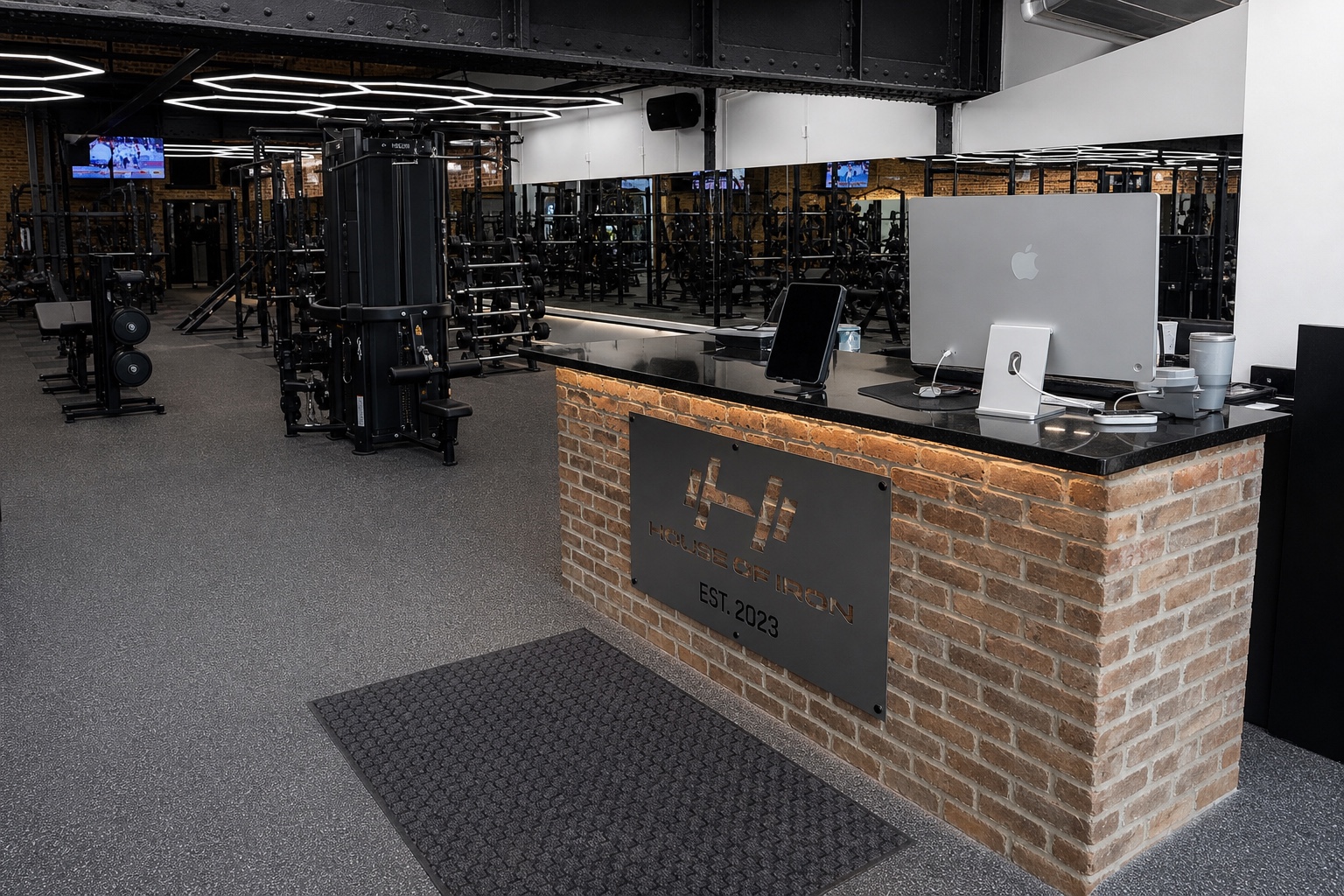 Brick reception desk and arrival path at House of Iron Downtown